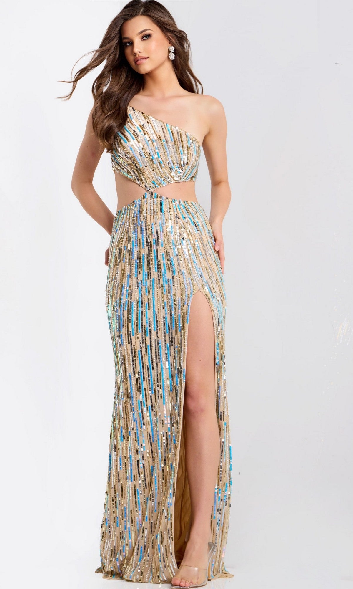 A woman in the Jovani 48526 long prom dress, with a one-shoulder design, gold and blue sequins, side cutout, and high slit, stands against a plain background.